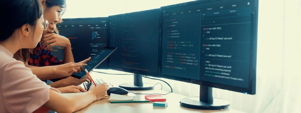 Group of professional web developer discuss about data analysis. Burgeoning. Stock Photos