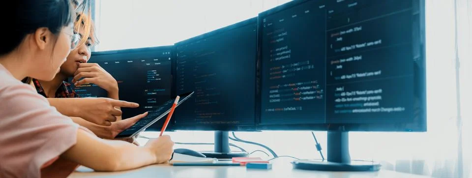 Group of professional web developer discuss about data analysis. Burgeoning. Stock Photos