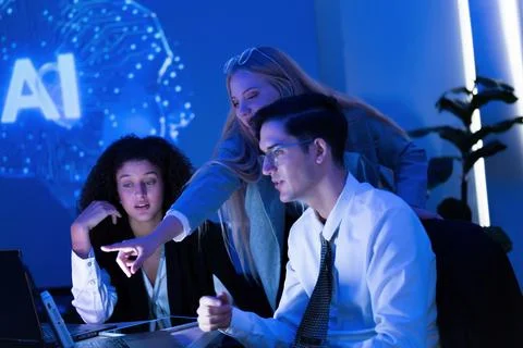 Group of professionals collaborating in a modern office on artificial intel.. Stock Photos