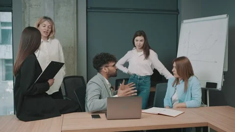 Group of professionals discuss strategy in modern office during meeting Stock Footage 330464694