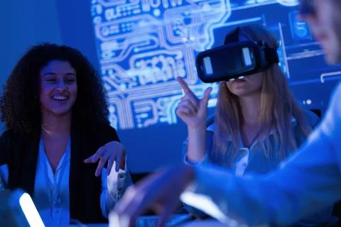 Group of professionals engaging in virtual reality training session in mode.. Stock Photos