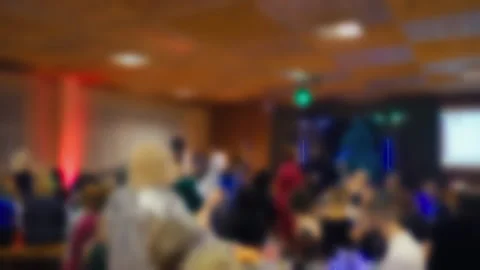 Group of professionals focused on corporate presentation within welllit Stock Footage 325007040
