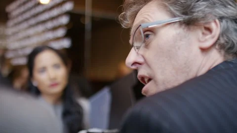 Group of professionals having a meeting in a coffee shop Stock Footage 87544301