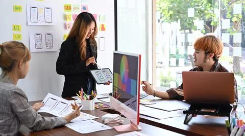 Group of professionals web developers brainstorming and working together for Stock Photos