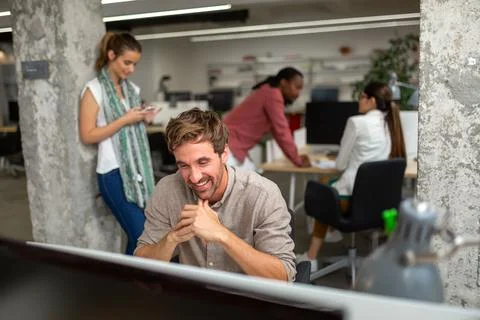 Group of programmer working in a software developing company office Stock Photos