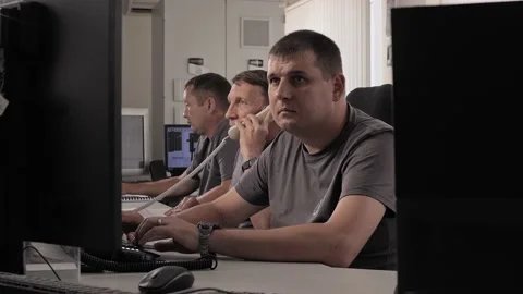 Group of programmers sit at computers in the office and work on the program code Stock Footage 212393489
