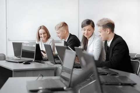 Group of Programmers working in the office of the software developer. Stock Photos