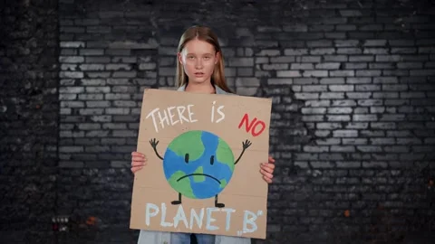 A group of protesting youth are against environmental pollution, global warming Stock Footage 233221129