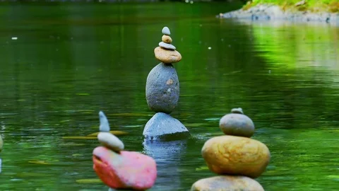 Group of pyramids made of stones in shallow pond. Calmness, meditation, zen Stock Footage 75011571