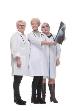Group of qualified doctors discussing an x-ray. Stock Photos