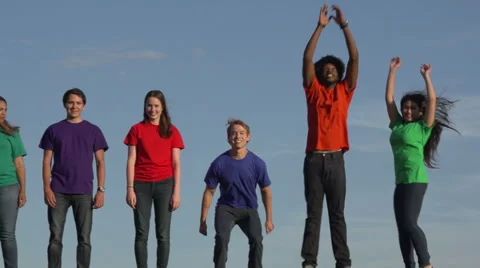 A group of racially-diverse students jump in slow motion Stock Footage 44117394