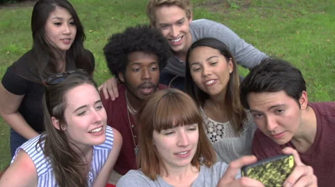 A group of racially-diverse students take a selfie. Stock Footage 44117221