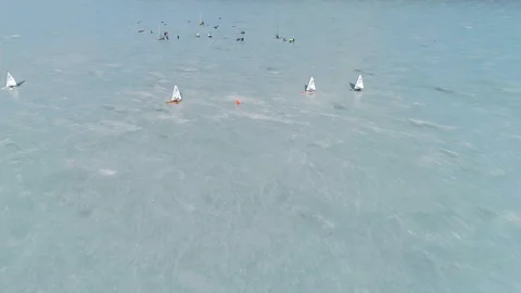 Group of racing ice yachts passing the leeward mark (international DN class) Stock Footage 88201592