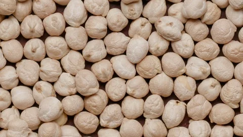 Group of raw chickpeas rotating in а circle Stock Footage 119896745