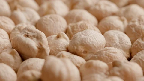 Group of raw chickpeas rotating in а circle Stock Footage 119896833