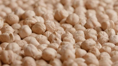 Group of raw chickpeas rotating in а circle Stock Footage 119896837