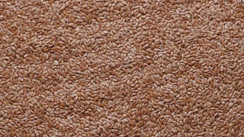 Group of raw flaxseeds rotating in а circle UNGRADED Stock Footage 119848273