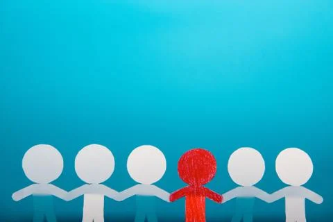 A group of red and white paper people Stock Photos