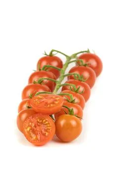 Group of red cherry tomato on branch, many units, isolated on white backgroun Foto stock