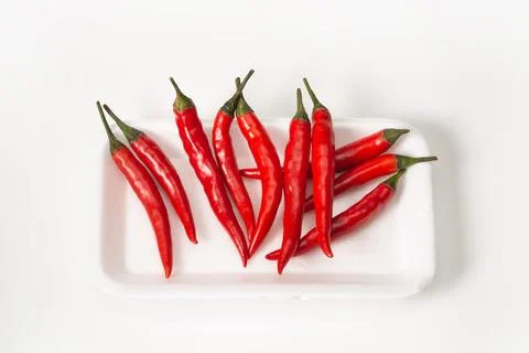 Group of red chilli peppers in package on white background. Red chilli pepper Stock Photos