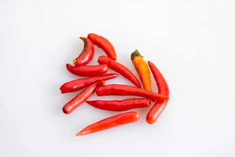 Group of red chilli peppers without stem on white background - top view Fotos Stock