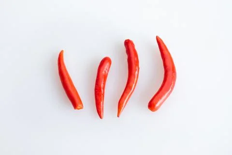 Group of red chilli peppers without stem on white background - top view Stock-Fotos