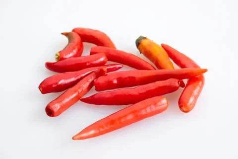 Group of red chilli peppers without stem on white background - top view Stock-Fotos