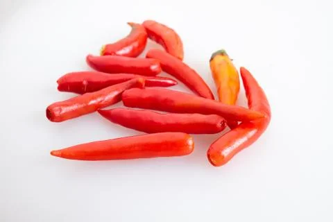 Group of red chilli peppers without stem on white background - top view Stock Photos