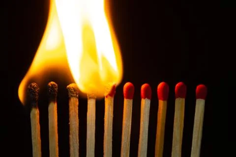 Group of red match burning isolated on black background. Stock Photos