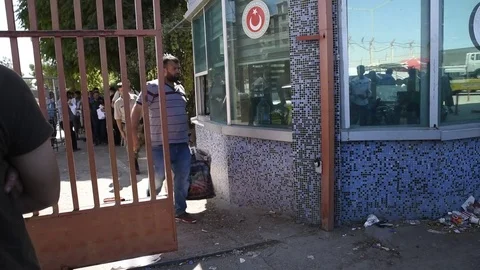 Group of refugees leaving Syria and going into Turkey. Video stock 79857853