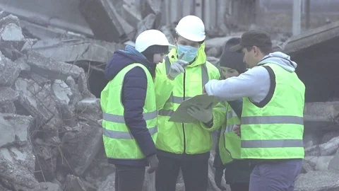 Group of rescue workers are studying the map Stock Footage 97956245