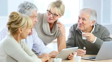 Group of retired senior people using laptop and tablet Stock Footage 55046803