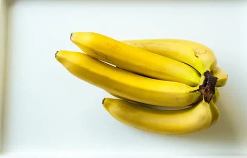 Group of ripe bananas on a white background. The view from the top Stock Photos