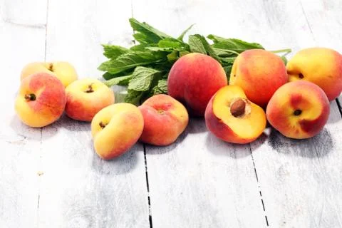 A group of ripe peaches on table Stock Photos