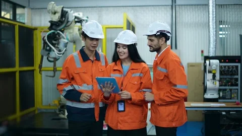 A group of Robotics engineers working with Programming and Manipulating Rob.. Video stock 280788914