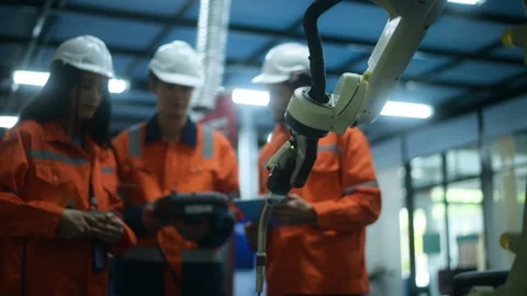 A group of Robotics engineers working with Programming and Manipulating Rob.. Video stock 280788923