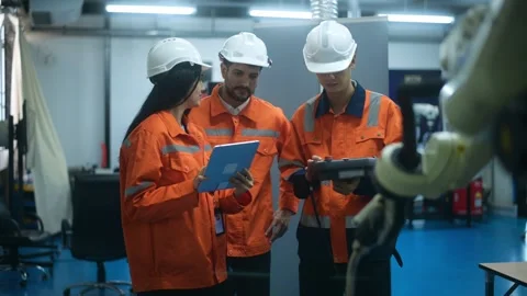 A group of Robotics engineers working with Programming and Manipulating Rob.. Video stock 280788924