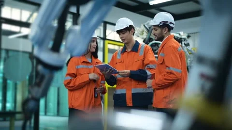 A group of Robotics engineers working with Programming and Manipulating Rob.. Stock Footage 280789040