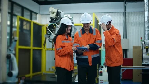 A group of Robotics engineers working with Programming and Manipulating Rob.. Video stock 280789066