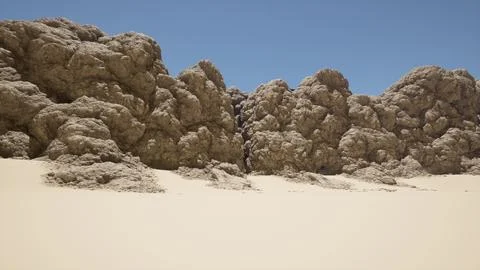 A group of rocks sitting on top of a sandy beach イラスト素材