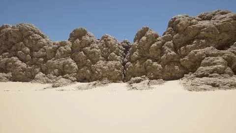 A group of rocks sitting on top of a sandy beach Stock Illustration