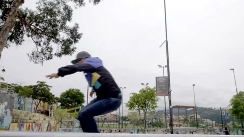 Group of rollerbladers jump and trick at skatepark Stock Footage 171463914