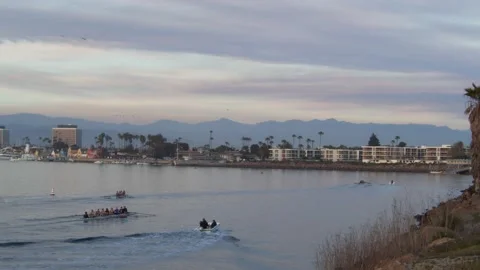 Group Of Rowboats Rowing into Harbor Town Stock Footage 171401014