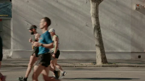 Group of runners compete in marathon or triathlon Stock-Footage 168297095