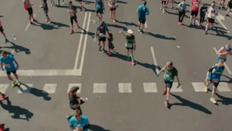 Group of runners compete in marathon or triathlon Video stock 258569395