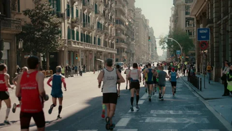 Group of runners compete in marathon or triathlon Stock Footage 258570672