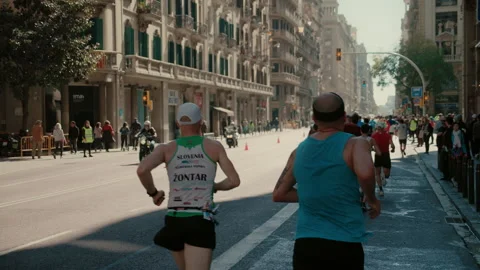 Group of runners compete in marathon or triathlon Video stock 258571875