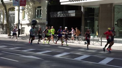 Group of runners in full effort during the Madrid marathon race Stock Footage 161709408
