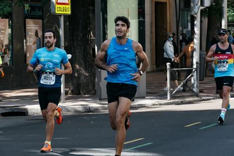 Group of runners in full effort during the Madrid marathon race Stock Photos