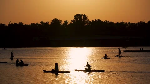 Group sap-surfing session at sunset. Stock Footage 279681822